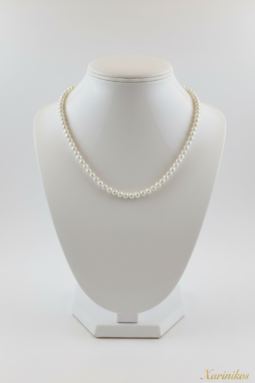 Classic White Pearl Necklace on jewelry display stand