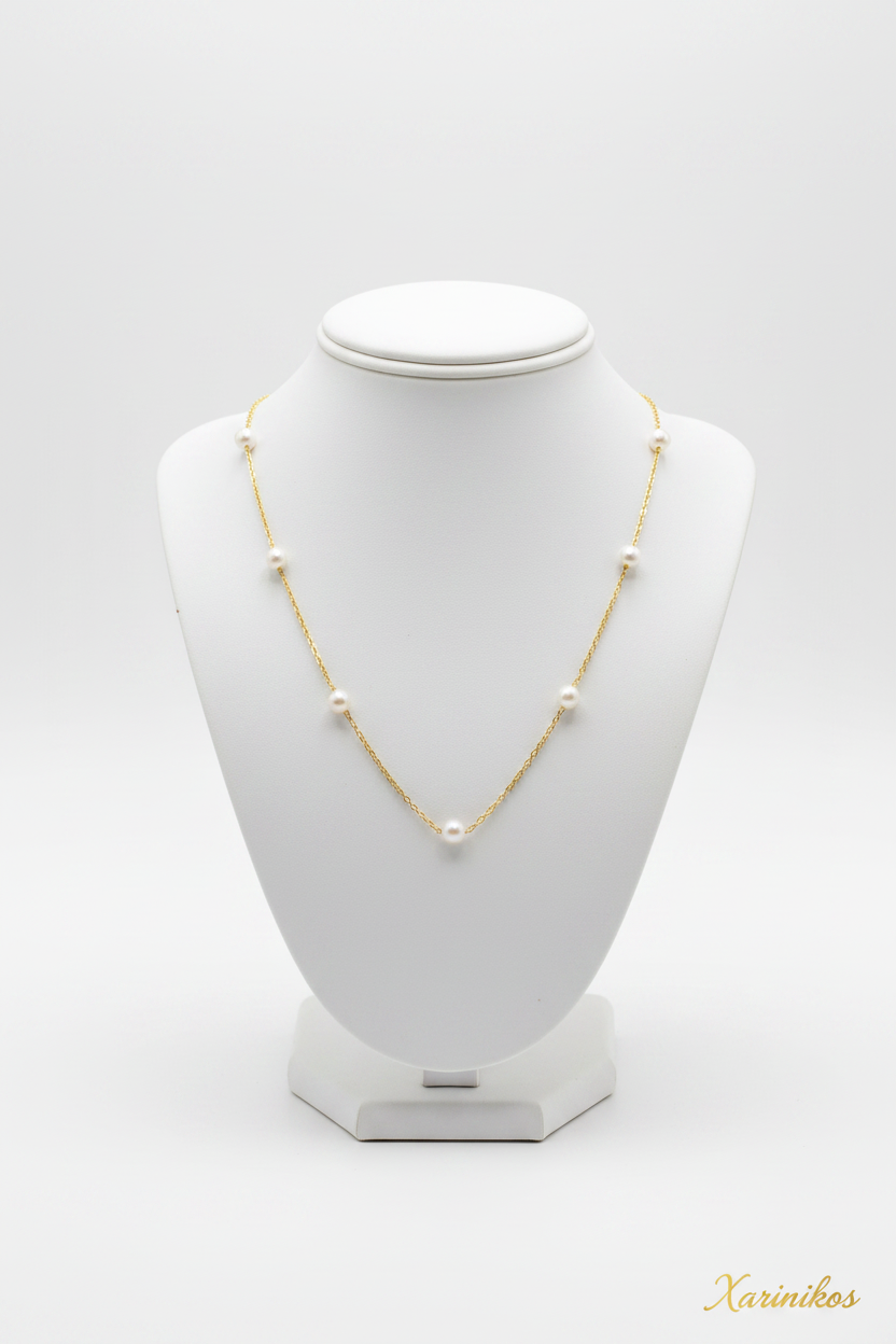 Handcrafted Steel Pearl Necklace on jewelry display stand