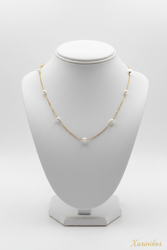 Floating Pearl Gold Necklace on jewelry display
